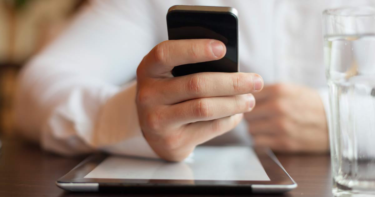 man-cellphone-tablet-fb