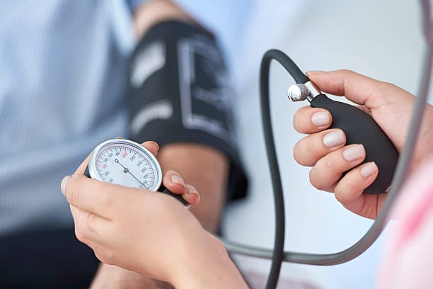 Nurse measuring blood pressure.